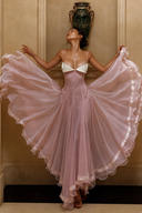 Blush pink petite wedding guest ruffle dress with ruched bodice and white lace bust detail