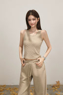 Casual beige knitwear outfit, oversized hoodie jacket, ribbed sleeveless crop top and wide leg trousers