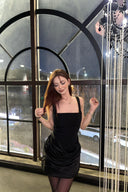 Vogsion black corset mini dress with draped ruched skirt — customer photo front pose
