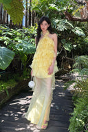 Vogsion Luna Fanned Maxi Dress in Spliced Floral worn by normal customer not professional model | Spring 2026 Kindred Spirit Collection tiered ruffle halter maxi dress in yellow/pink – perfect boho wedding guest look