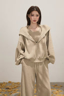 Casual beige knitwear outfit, oversized hoodie jacket, ribbed sleeveless crop top and wide leg trousers