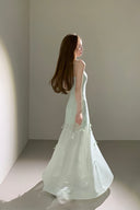 Trendy multiway dress for women, flowing chiffon layers with adjustable bows, styled for summer resort wear, chic evening looks, and fashion influencer outfits.