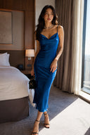 Vogsion Celeste Royal Blue wedding guest dress with a cowl neck and fitted maxi silhouette