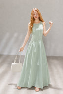 Model wearing the Lemon Green VOGSION Clémence cotton petite maxi dress with a flowing A-line skirt