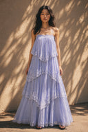 Vogsion Seraphina Tiered Chantilly Lace Maxi Dress in soft lavender featuring layered lace ruffles, flowing fairy-inspired silhouette, romantic pastel maxi dress for weddings, garden parties, vacation and feminine coquette fashion.