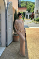 VOGSION Sahara Mirage sand beige long sleeve maxi wedding guest dress with off-shoulder draping