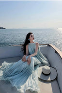 Vogsion Elysian Tiered Pleated Chiffon Maxi Dress in soft seafoam blue – flowy vacation resort wear summer maxi dress with tiered ruffles, worn by real customer on yacht, lightweight pleated chiffon elegant beach dress with global fast shipping