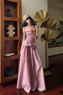 Vogsion Thalassa Striped Strapless Corset Maxi Dress – real customer wearing striped corset top and pink velvet maxi skirt in elegant summer resort outfit, 2026 beach vacation style with global fast shipping