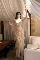 Vogsion Beige Floral Bow V-Neck Dress worn by a customer, featuring tiered floral lace, high slit, and French-inspired aesthetic