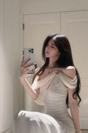 Vogsion Signature Pleated Draped Shoulder Dress in Ivory – elegant white pleated draped shoulder maxi dress worn by real customer, off shoulder formal evening gown 2026 trend
