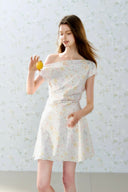 Romantic off-shoulder floral mini dress by Vogsion, pastel flower pattern, A-line silhouette, soft feminine French style perfect for spring and summer days.