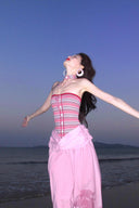 Vogsion Thalassa Striped Strapless Corset Maxi Dress – real customer wearing striped corset top and pink velvet maxi skirt in elegant summer resort outfit, 2026 beach vacation style with global fast shipping