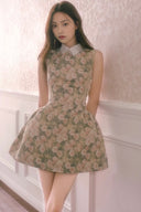 Model wearing Vogsion La Fleur de Mémoire vintage floral mini dress with white collar, soft lighting and romantic Parisian aesthetic