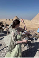 Vogsion Sage Green Ruched Bow Front Maxi Dress with Sheer Shawl wind-blown at Pyramids of Giza worn by real customer