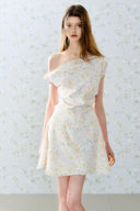 Romantic off-shoulder floral mini dress by Vogsion, pastel flower pattern, A-line silhouette, soft feminine French style perfect for spring and summer days.