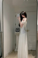 Vogsion Signature Pleated Draped Shoulder Dress in Ivory – elegant white pleated draped shoulder maxi dress worn by real customer, off shoulder formal evening gown 2026 trend