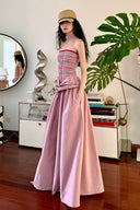 Vogsion Thalassa Striped Strapless Corset Maxi Dress – real customer wearing striped corset top and pink velvet maxi skirt in elegant summer resort outfit, 2026 beach vacation style with global fast shipping