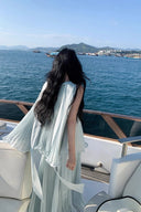 Vogsion Elysian Tiered Pleated Chiffon Maxi Dress in soft seafoam blue – flowy vacation resort wear summer maxi dress with tiered ruffles, worn by real customer on yacht, lightweight pleated chiffon elegant beach dress with global fast shipping