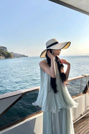 Vogsion Elysian Tiered Pleated Chiffon Maxi Dress in soft seafoam blue – flowy vacation resort wear summer maxi dress with tiered ruffles, worn by real customer on yacht, lightweight pleated chiffon elegant beach dress with global fast shipping