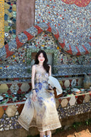 Vogsion Dawning Floral Corset Midi Dress featuring a blue and white boho floral pattern and tie straps, shown on a customer in a scenic vacation setting