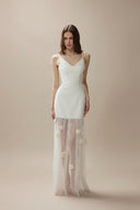Vogsion Aurelia white corset dress with 3D floral tulle skirt on customer at luxury dinner, 2026 fashion trends.