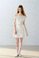 Romantic off-shoulder floral mini dress by Vogsion, pastel flower pattern, A-line silhouette, soft feminine French style perfect for spring and summer days.