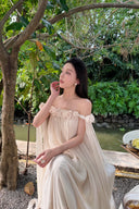Vogsion Off-Shoulder Pleated Maxi Dress Cream Rose Appliqué worn by real customer in lush garden 2026 summer dress