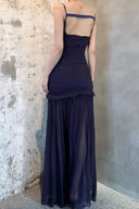 Vogsion OUDE 100% Silk Smocked Pleated Maxi Dress in Smoke Lavender or Soft Pink – real Vogsion customer wearing elegant spaghetti strap silk maxi with smocked bodice, ruffle trim and flowing pleated skirt, global fast shipping