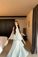 Vogsion Elysian Tiered Pleated Chiffon Maxi Dress in soft seafoam blue – flowy vacation resort wear summer maxi dress with tiered ruffles, worn by real customer on yacht, lightweight pleated chiffon elegant beach dress with global fast shipping