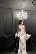 Vogsion Aurelia white corset dress with 3D floral tulle skirt on customer at luxury dinner, 2026 fashion trends.