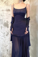 Vogsion OUDE 100% Silk Smocked Pleated Maxi Dress in Smoke Lavender or Soft Pink – real Vogsion customer wearing elegant spaghetti strap silk maxi with smocked bodice, ruffle trim and flowing pleated skirt, global fast shipping