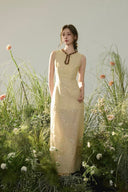 Vogsion Élan Butter Yellow Garden Party Maxi Dress with beaded neckline, sequin embellishments, and linen-look texture styled in a sunlit garden by a normal customer