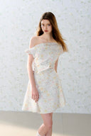 Romantic off-shoulder floral mini dress by Vogsion, pastel flower pattern, A-line silhouette, soft feminine French style perfect for spring and summer days.