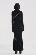 Vogsion x Nophora Obsidian Ecliptic Avant-Garde Maxi Gown worn by a customer, featuring black turtleneck, shoulder cut-outs, and diagonal sheer mesh panels.