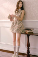 Sleeveless rose jacquard mini dress with vintage floral texture and A-line silhouette, styled with white socks and ballet shoes