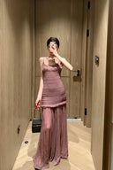 Vogsion OUDE 100% Silk Smocked Pleated Maxi Dress in Smoke Lavender or Soft Pink – real Vogsion customer wearing elegant spaghetti strap silk maxi with smocked bodice, ruffle trim and flowing pleated skirt, global fast shipping