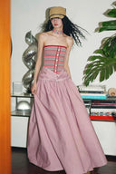 Vogsion Thalassa Striped Strapless Corset Maxi Dress – real customer wearing striped corset top and pink velvet maxi skirt in elegant summer resort outfit, 2026 beach vacation style with global fast shipping