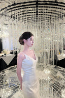 Vogsion Aurelia white corset dress with 3D floral tulle skirt on customer at luxury dinner, 2026 fashion trends.