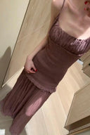 Vogsion OUDE 100% Silk Smocked Pleated Maxi Dress in Smoke Lavender or Soft Pink – real Vogsion customer wearing elegant spaghetti strap silk maxi with smocked bodice, ruffle trim and flowing pleated skirt, global fast shipping
