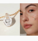 Gold necklace with a diamond pendant next to a close-up of a woman wearing the necklace.