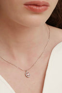 Vogsion Darcy Reverie Oval Gemstone Pendant Necklace worn by a person, focusing on the jewelry.