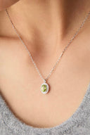 Vogsion Darcy Reverie Oval Gemstone Pendant Necklace on a person wearing a gray sweater.