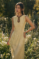 Vogsion Élan Butter Yellow Garden Party Maxi Dress with beaded neckline, sequin embellishments, and linen-look texture styled in a sunlit garden by a normal customer