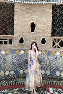 Vogsion Dawning Floral Corset Midi Dress featuring a blue and white boho floral pattern and tie straps, shown on a customer in a scenic vacation setting