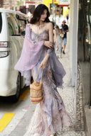 Street style view of the Vogsion lavender floral ruffle dress and matching sheer shrug.