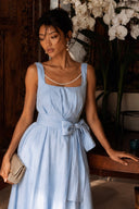 Front view highlighting the Azure Linen Sky-Blue/Beige A-Line Backless Pearl Wide-Leg Jumpsuit with the removable pearl chain styled across the neckline, square neck, waist tie and soft linen fabric.