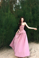 Vogsion Thalassa Striped Strapless Corset Maxi Dress – real customer wearing striped corset top and pink velvet maxi skirt in elegant summer resort outfit, 2026 beach vacation style with global fast shipping