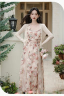 Vogsion Elysian Rose floral maxi dress worn by customer in a sunlit garden