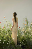 Vogsion Élan Butter Yellow Garden Party Maxi Dress with beaded neckline, sequin embellishments, and linen-look texture styled in a sunlit garden by a normal customer