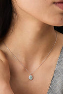 Close-up of a Vogsion Darcy Reverie Oval Gemstone Pendant Necklace on a person's neck